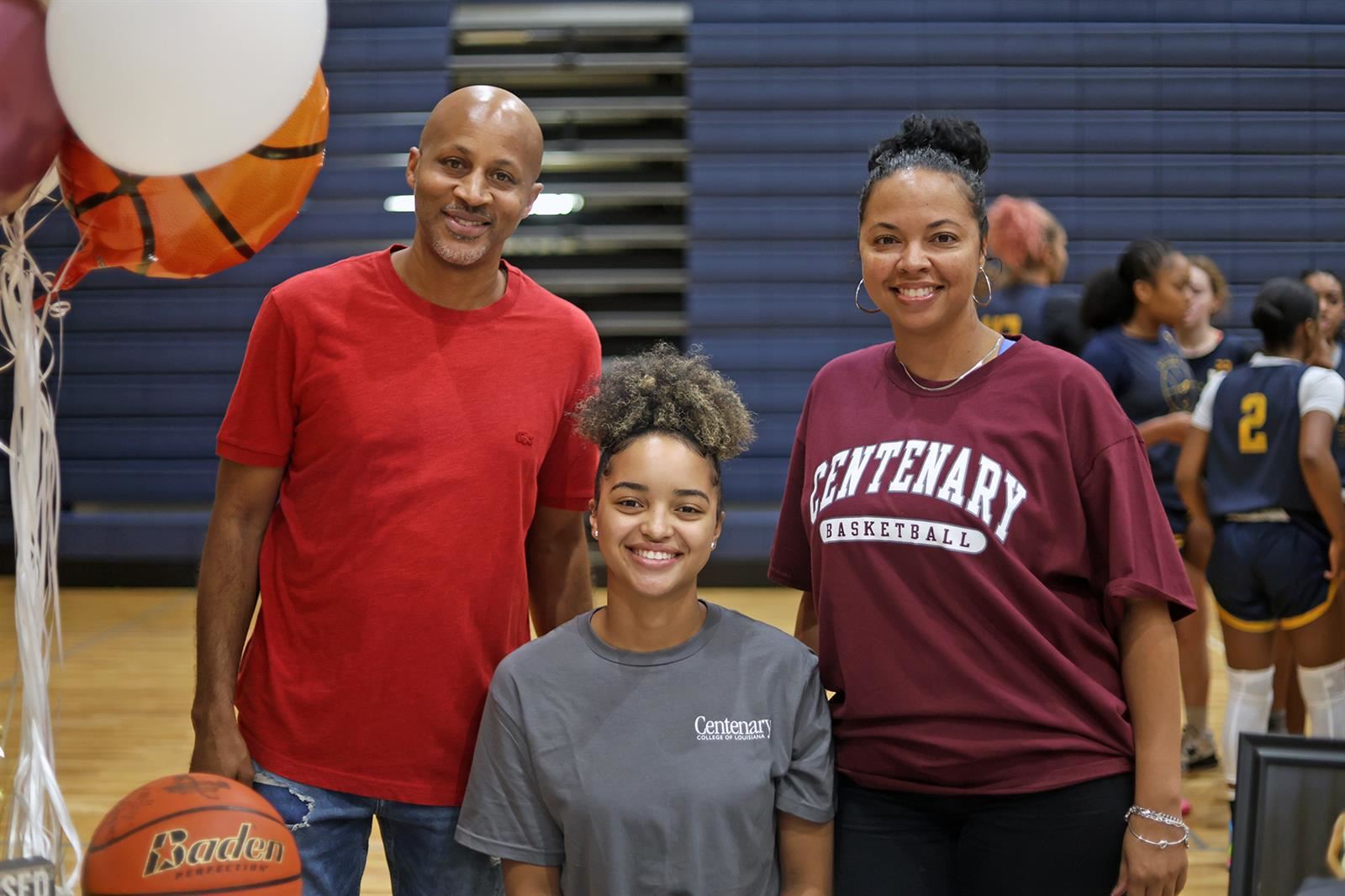 Cypress Ranch High School senior Alexis Duhon, seated, signed a letter of intent to play basketball at Centenary College.